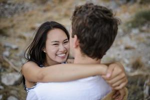 Young couple walking in the mountains photo