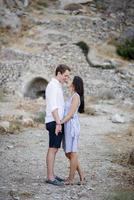 Young couple walking in the mountains photo