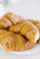 Fresh croissant on a white background. Top view Copy space photo