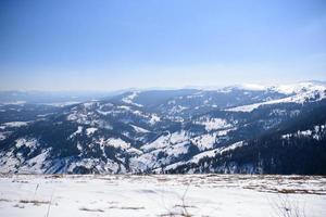 Majestic winter landscape glowing by sunlight in the morning. Dramatic wintry scene. Location Carpathian, Ukraine, Europe. Beauty world. Retro and vintage style, soft filter. Instagram toning effect. photo