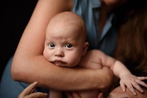 Young parents have fun with their little son photo