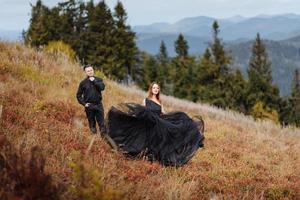 Wedding couple on a background of autumn mountains. photo