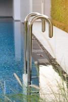 Metal staircase to the entrance to the swimming pool photo