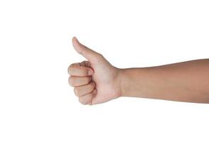 The woman shows the gesture of thumbs up with an arm isolated on white background with a clipping path. photo