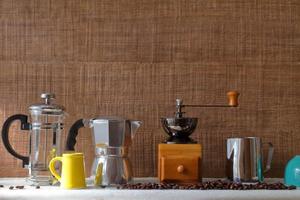 Traditional coffee maker tools for homemade style on wooden background with copy space photo