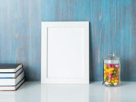 mock up frame on blue wooden wall photo