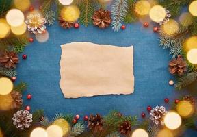 Christmas and Happy New Year dark blue background with craft paper for text and bokeh