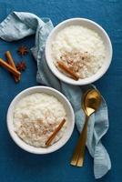 Rice pudding. French milk rice dessert. Healthy Vegan diet breakfast. Top view, vertical photo