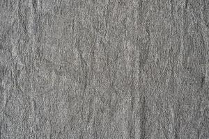 Natural linen texture background. Crumpled fabric of gray color, rough texture photo