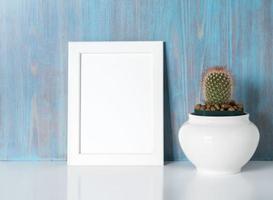 mock up frame on blue wooden wall photo