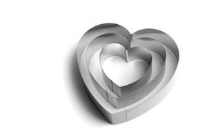 molde de metal en forma de corazón sobre un fondo blanco.foto aislada foto