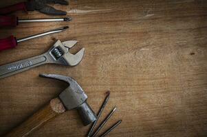 Top view of working tools on wooden desk. photo
