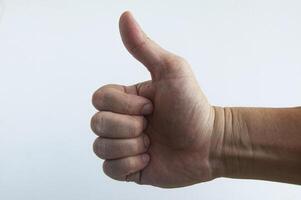 Thumbs up with white background. Expression for a good job. Conceptual photo