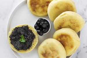 Homemade harcha semolina bread pancakes with olives mashed photo