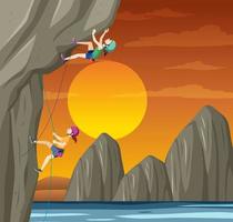 Rock climber on cliff at sunset time vector