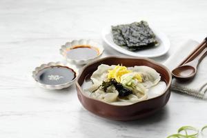 TteokMandu Guk, Korean Dumpling and Rice Cake Soup photo