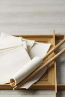 Wonton Wrapper Sheet on Bamboo Plate, with Chopstick photo