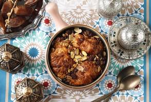 Top View Pastry Croissant Creamy Bread Pudding, Egyptian Um Ali or Oum Ali, Soakede Pastry with Milk photo