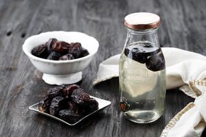 Kurma Nabeez, Date Fruit Overnight Infused Water in a Bottle, Popular Healthy Drink during Ramadhan. photo