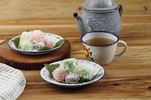 Sentiling, Steamed Grated Cassava with Food Coloring, Coated with Grated Coconut photo