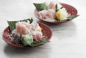 Ongol Ongol Singkong, Indonesian Traditional Steamed Cake Made From Cassava with Garted Coconut Coating. One Various of Jajanan Pasar