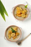 Kolak or Kolak Pisang is Indonesian dessert, very popular during Ramadhan, made from banana, kolang-kaling, sweet potato cooked with coconut milk, palm sugar and pandanus leaves. photo