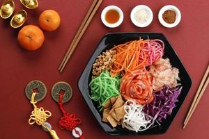 Yee Sang Chinese New Year Dinner for Prosperity Toss Celebration also known by Yu Sheng Spring Toss. photo