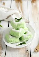 Indonesian Traditional steamed cake Kue Putu Ayu, made from rice flour, grated coconut, pandanus and suji leaves, photo