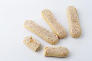 Italian Savoiardi ladyfingers Biscuits on White Background photo