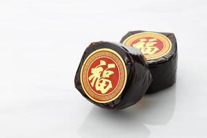 Chinese New Year Cake with Chinese character Fu means Fortune. Popular as Kue Keranjang or Dodol China in Indonesia. photo