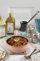 Traditional Egyptian Sweet Pastry Dessert Bread Pudding Om Ali or Umm Ali of Soaked Bread, Milk and Load of Roasted Nuts, Almond, Pistachio, Raisins