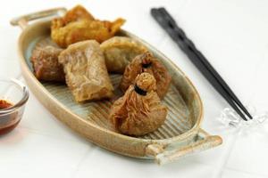 Various Fried Dumpling, Kuotie, Gyoza, Lumpia on Oval Plate photo