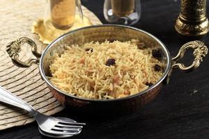 Kashmiri pulao made of Basmati rice cooked with spices and flavored with Saffron and dry fruits photo