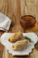 Pisang Molen, Indonesian Traditional Snack Made from RIpe Banana Wrap with Flour Pastry Batter and Deep Fried. photo