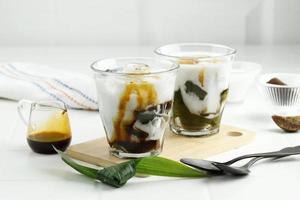 Es Daluman. Balinese cold dessert drink of grass jelly with coconut milk and palm sugar syrup.