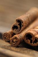 Close Up CInnamon Stick on Brown Background photo