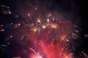 fireworks on the river in the dark sky photo