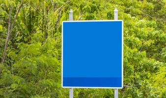 Blank empty blue typical Asian street road sign Phuket Thailand. photo