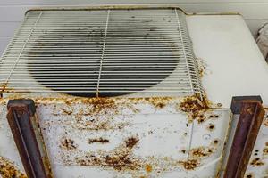 Dirty old rusted air conditioner at Naithon Beach Phuket Thailand. photo