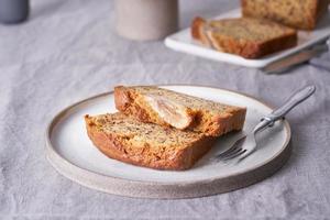 Banana bread. Cake with banana, traditional american cuisine. Slices of loaf in plate photo