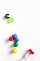 Game cubes, chips, hourglass on a white background. T photo