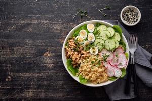 Buddha bowl, balanced food, vegetarian menu, dash diet. Dark wooden table photo