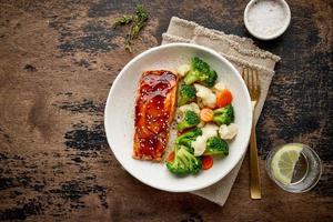 Steam salmon and vegetables, Paleo, keto, fodmap, dash diet. Mediterranean food with steamed fish. photo