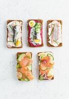 Savory fish smorrebrod, set of five traditional Danish sandwiches photo