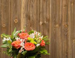 bouquet of flowers on a wooden background photo