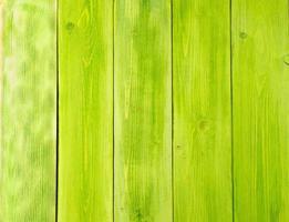 painted in green, wooden background from pine boards photo