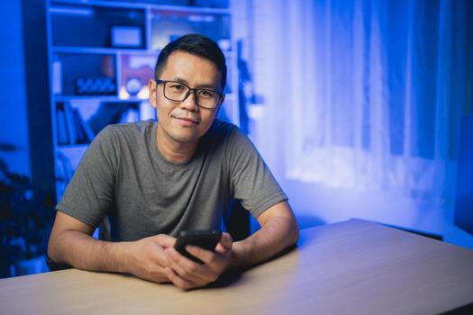 Social media and digital online concept, man using smart phone with Social media. The concept of living on vacation and playing social media. Social Distancing ,Working From Home concept. photo