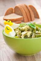 String beans with eggs in bowl. photo