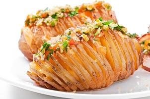 Baked potato with cheese and butter photo