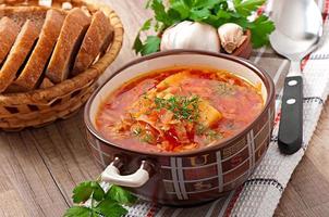 Ukrainian and russian national red soup borsch closeup photo